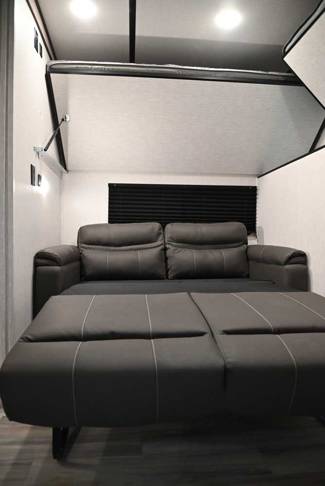 Extended sofa bed inside a bunk room.
