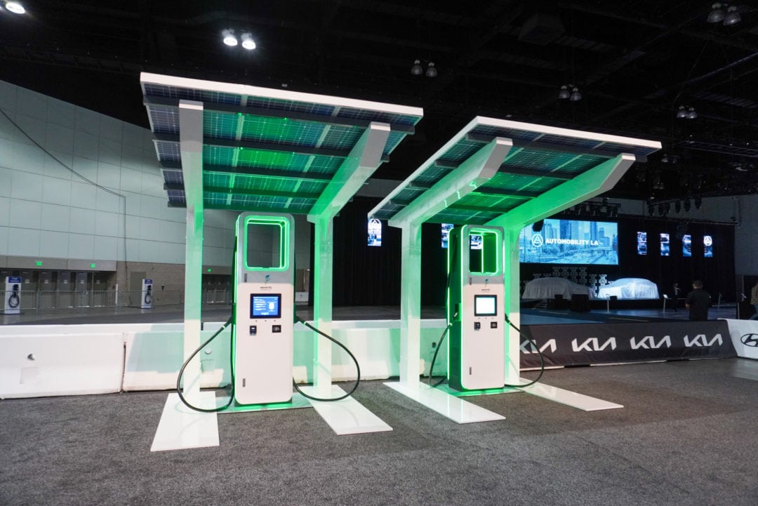 Two EV charging stations inside a convention center