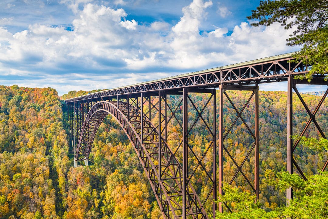 new river gorge bridge surrounded by colorful fall foliage