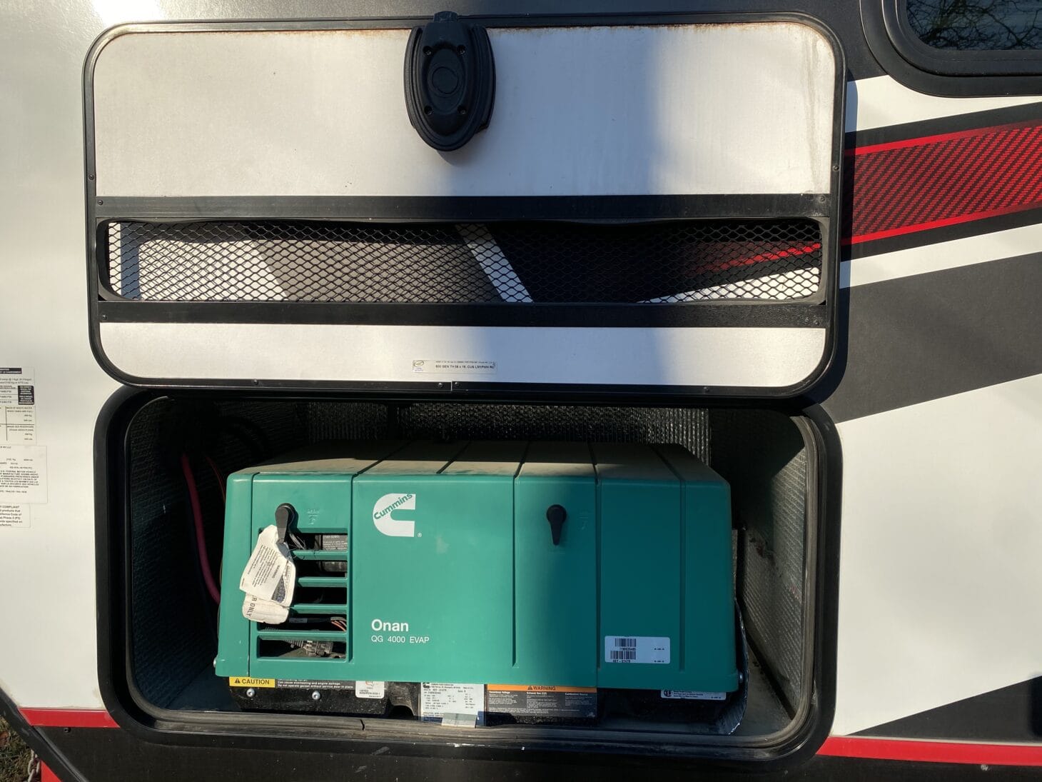 Generator sitting inside the exterior cargo bay of an RV