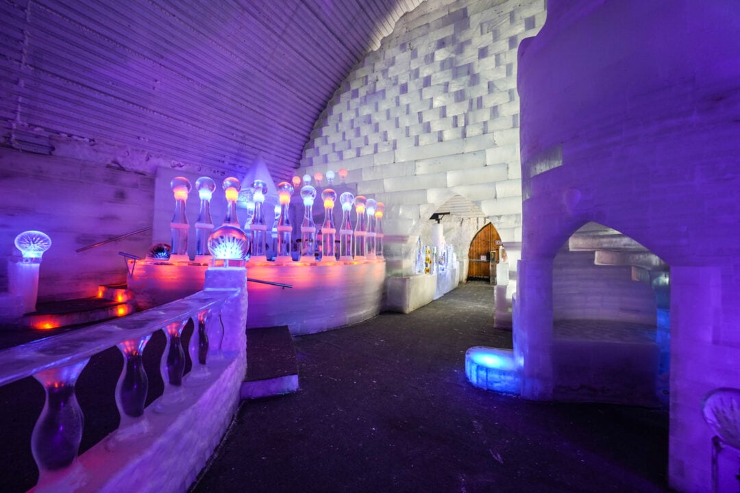 the inside of an ice structure with colorful lights