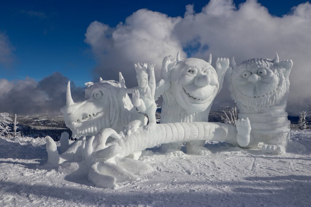 a snow carving made to look like the monsters from where the wild things are