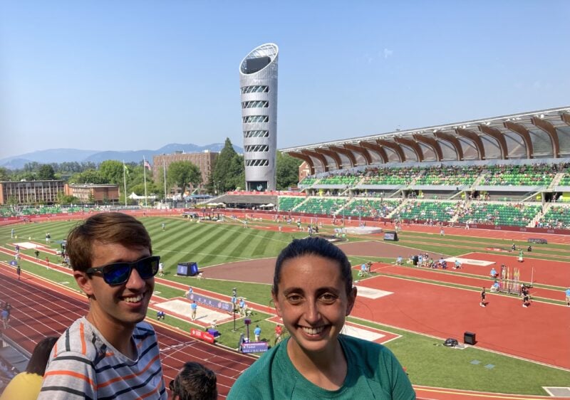 Two people at Hayward Field, a track and field stadium.