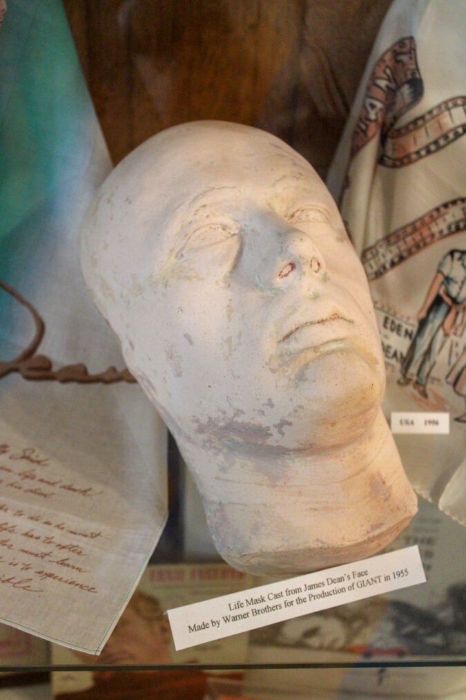 a white cast of a life mask of james dean on display in a museum
