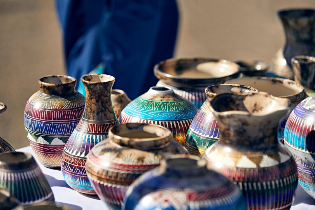 colorful native american pottery sits on a table