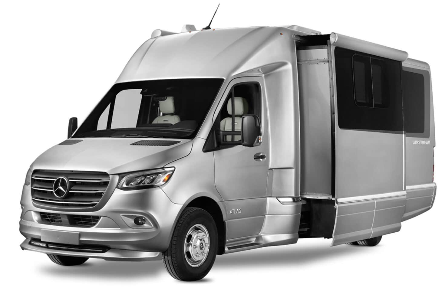 Exterior image of a silver Class B+ RV with an extended slide out