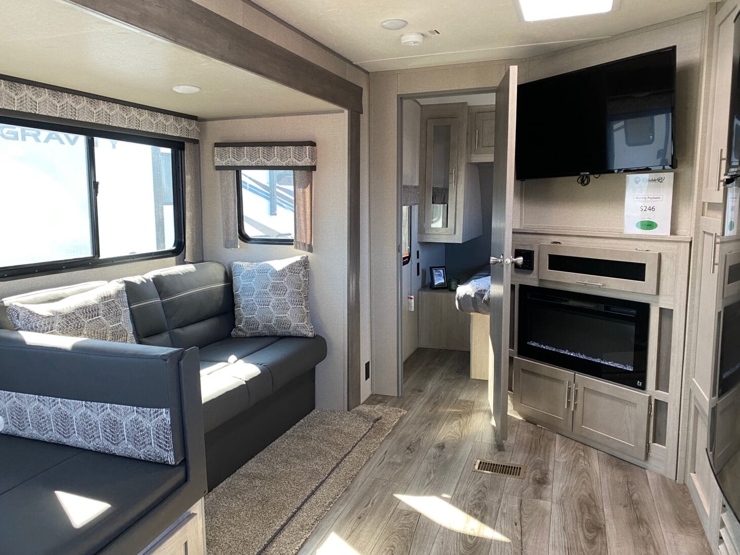 An RV interior with slides extended to show the extra living space inside.