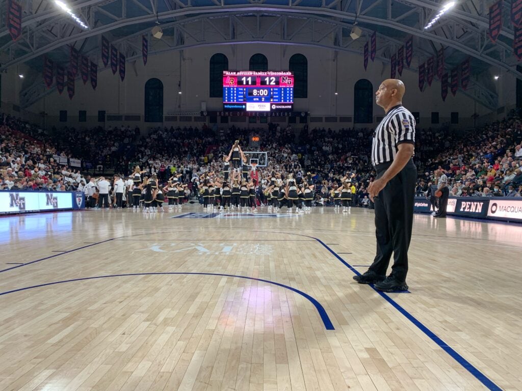 Basketball referee standing near the baseline at the Palestra gym in Philadelphia