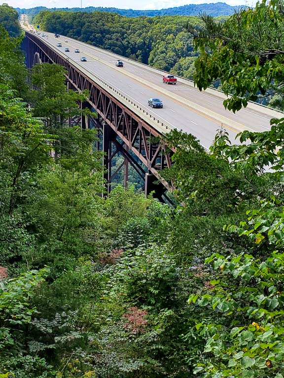 Cars going over a bridge that runs above the New River Gorge