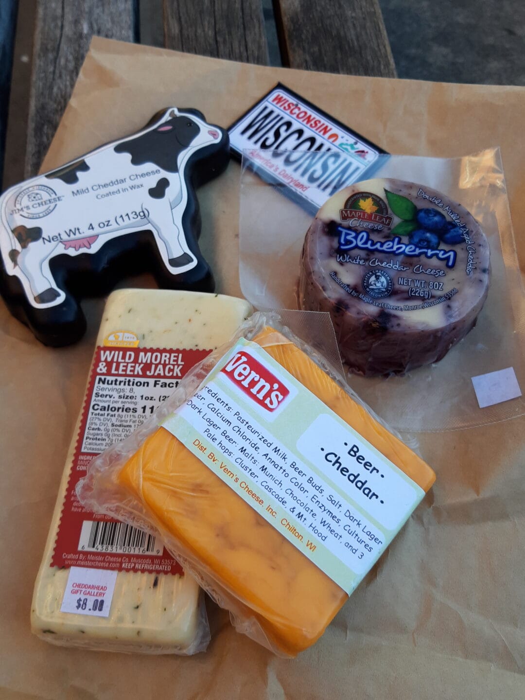 Four packages of different cheeses from Wisconsin