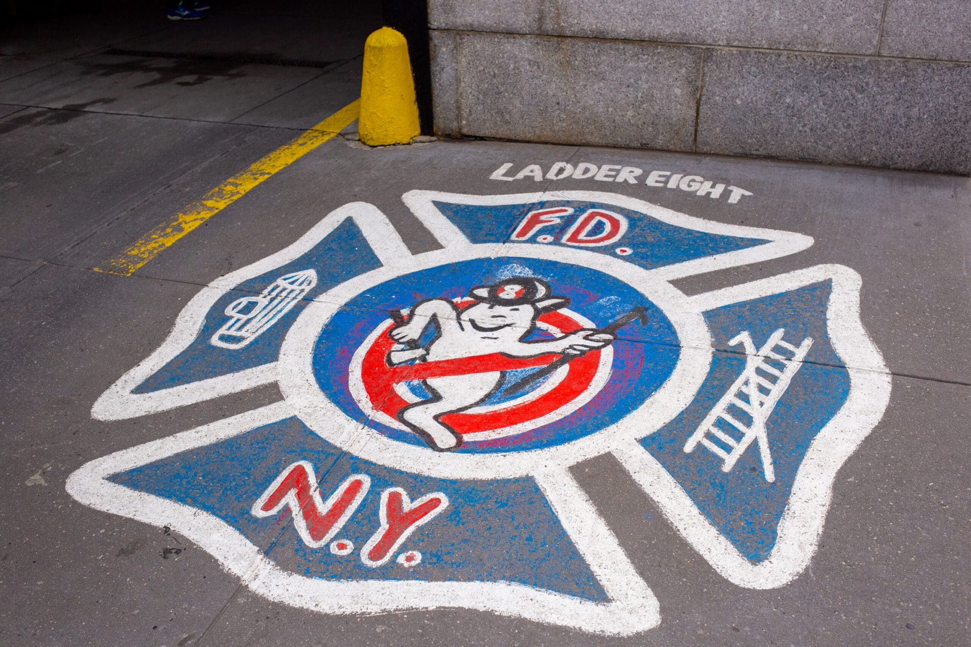 red white and blue artwork on the street featuring a ghost in a firehat