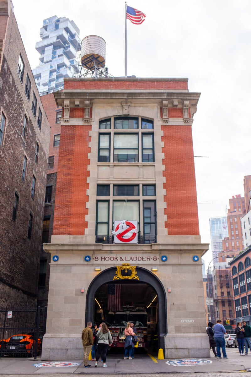 a three story brick and stone firehouse on a corner in new york city