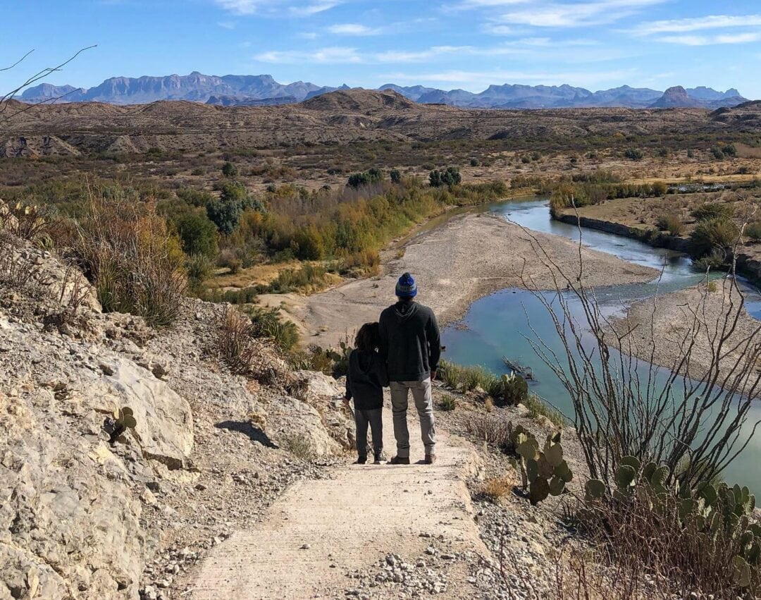 Father and son standing on a trail in Big Bend National Park