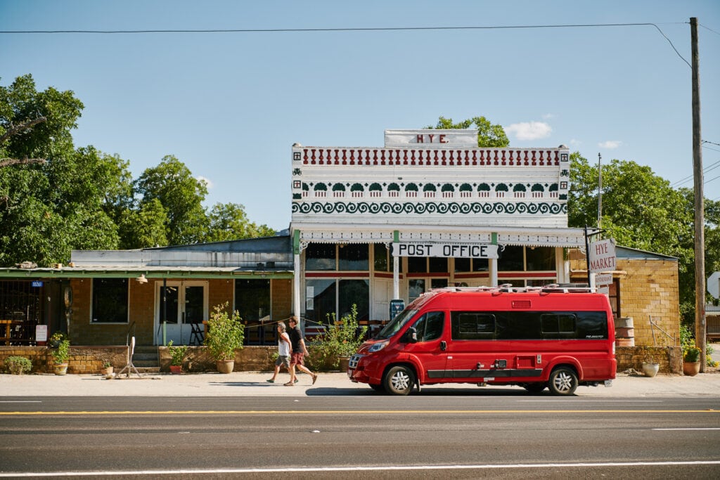 Red van in front of van rental company