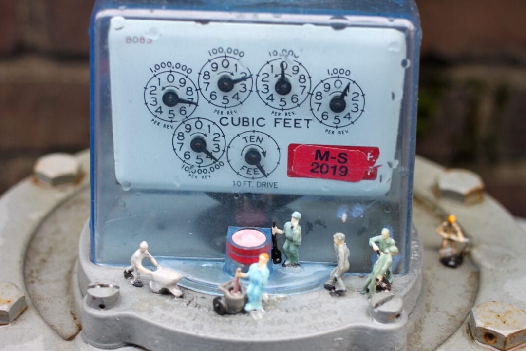 a meter box with miniature figures on top