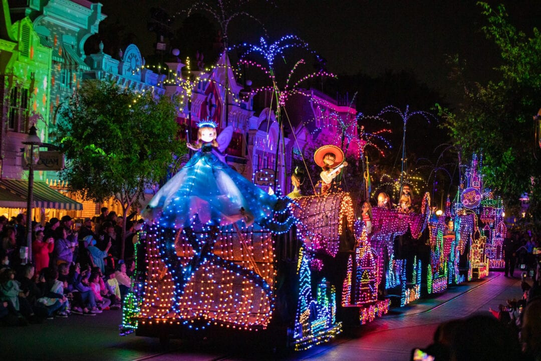 a parade of colorful lights at night