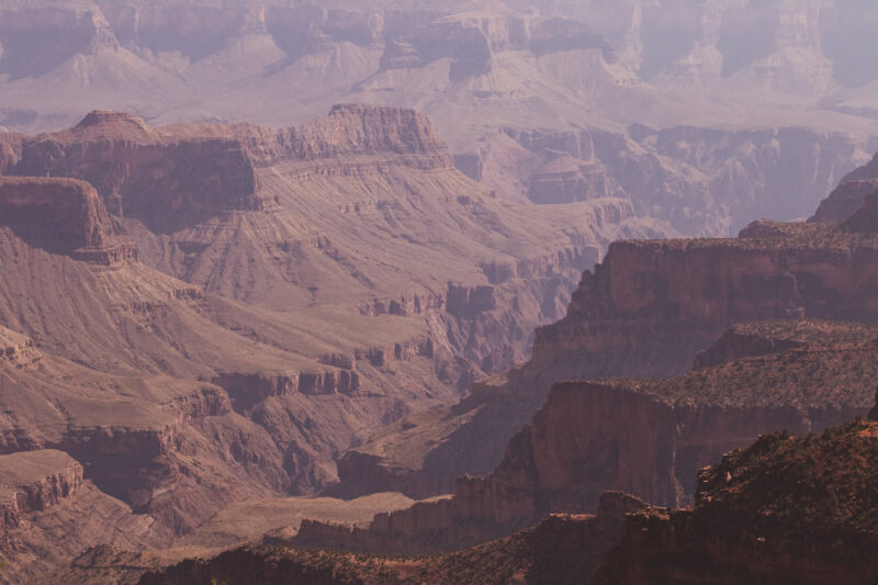 a view of a large canyon filled with red rock formations
