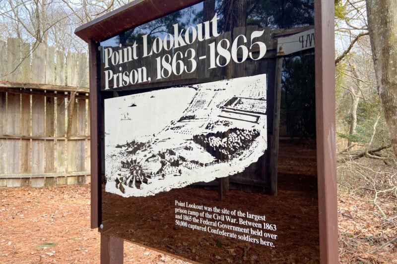an informational sign for the point lookout prison