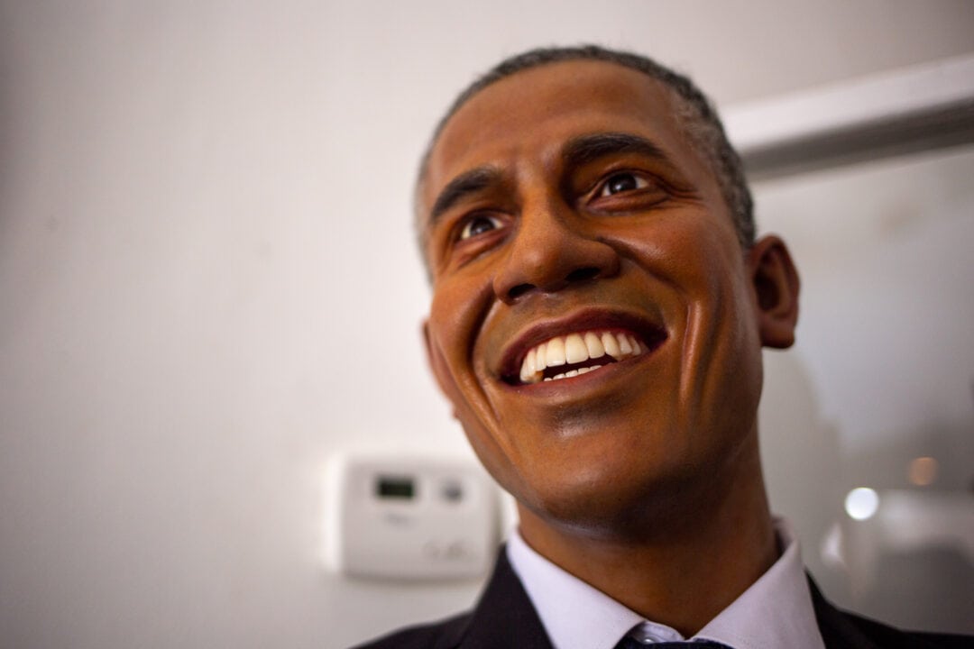 A wax figure of barack obama smiling