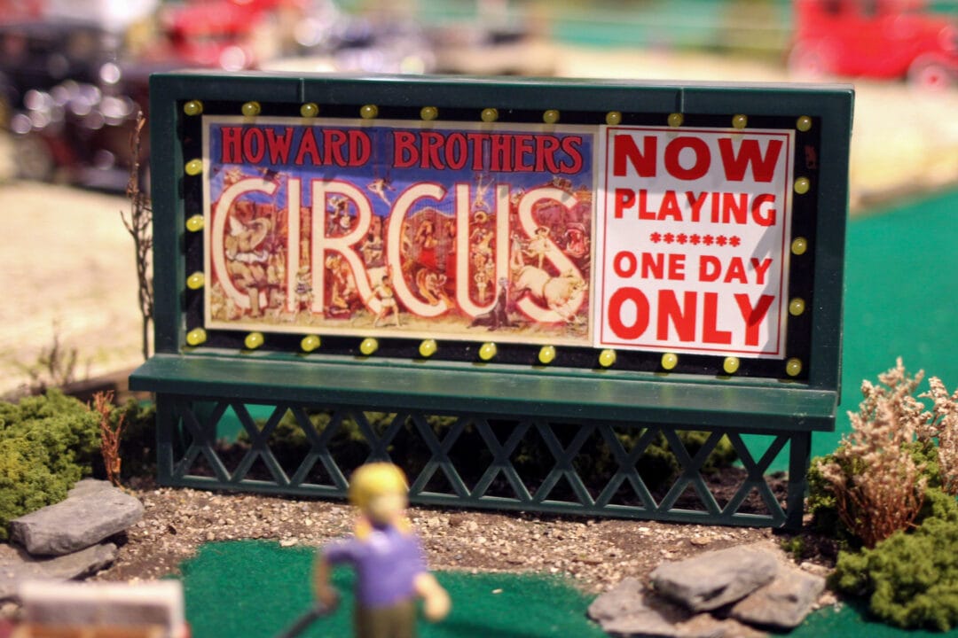 a miniature billboard that says "howard brothers circus now playing one day only"