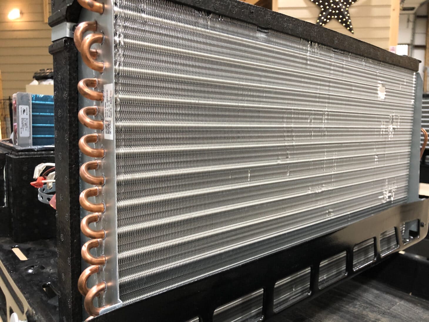The condenser coils in an RV air conditioner unit