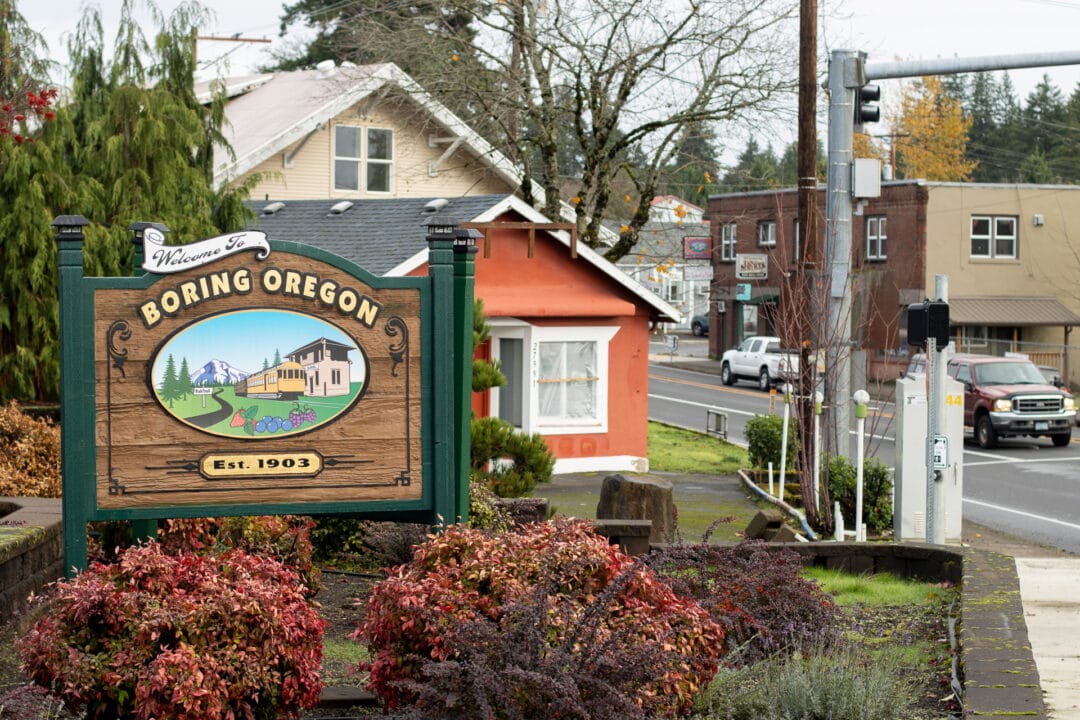 The welcome sign of Boring, Oregon, is seen by the roadside.