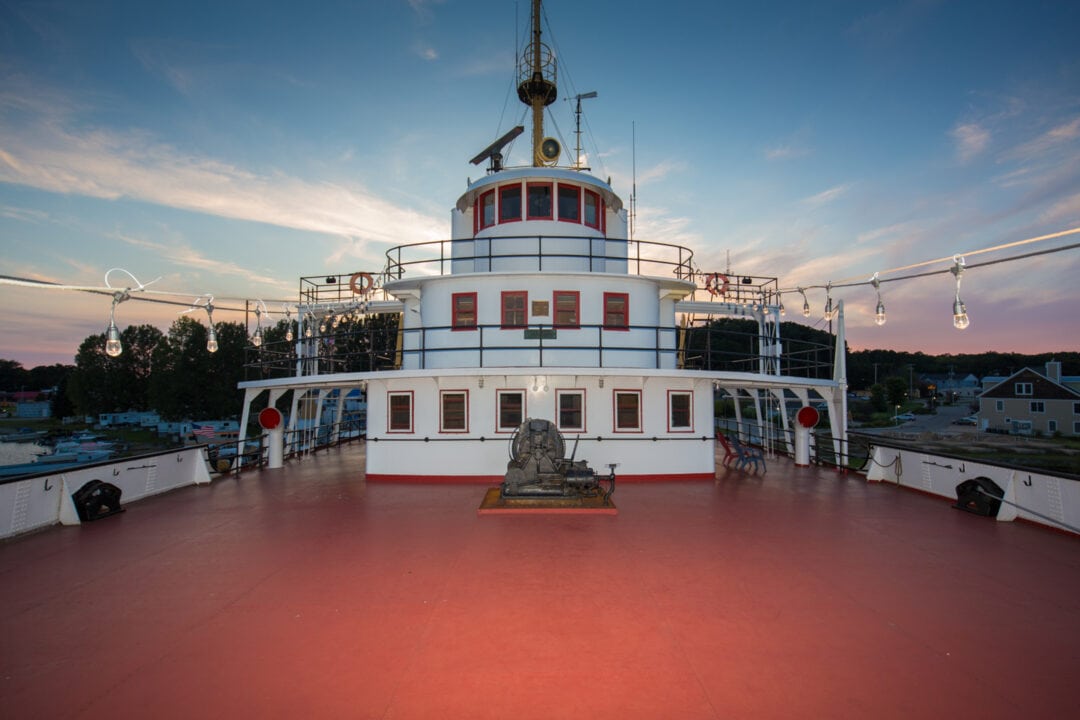 the deck of a ship at sunset