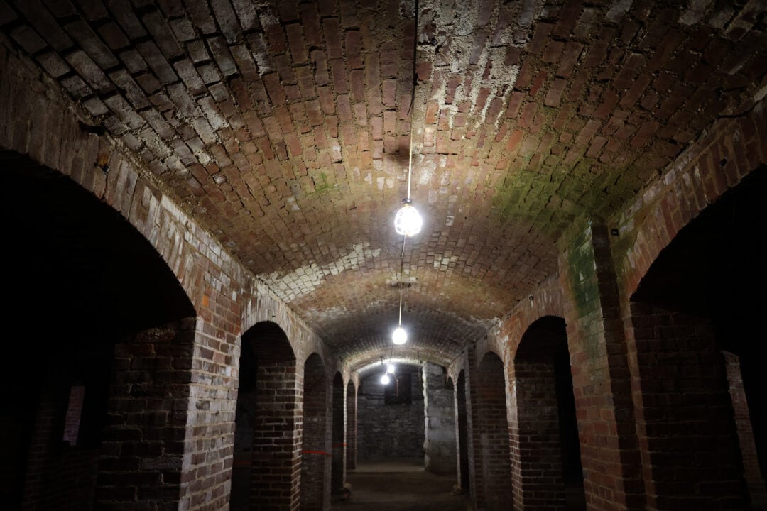 brick catacombs at night