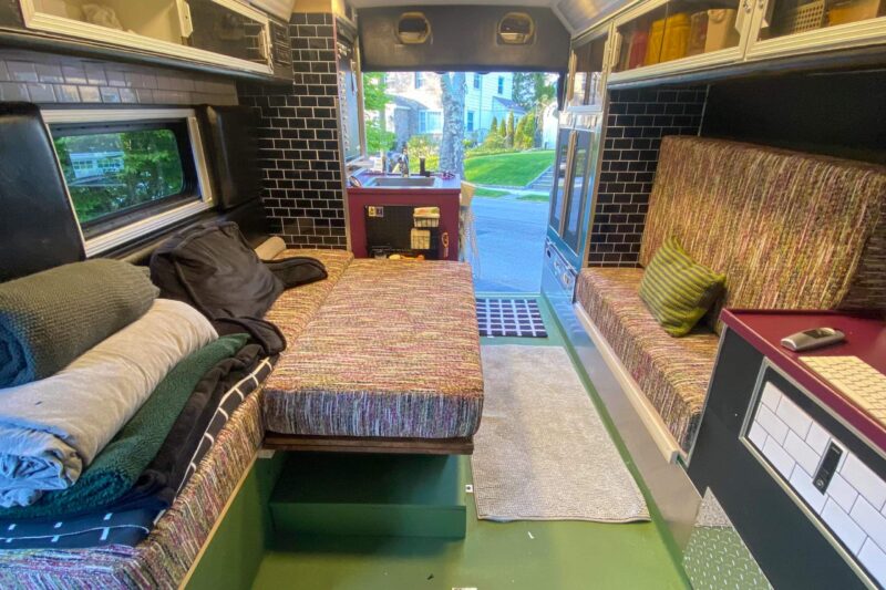 the inside of an ambulance renovated into a campervan