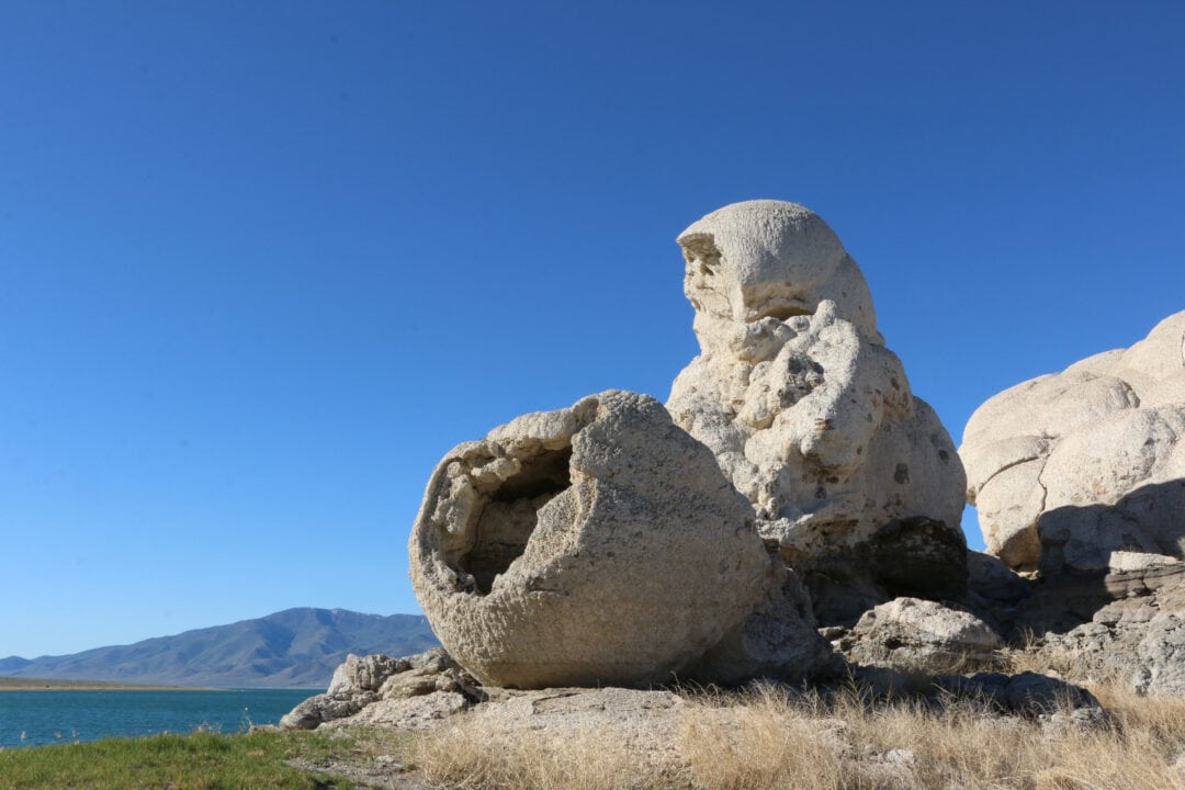 a rock formation set against a clear blue sky