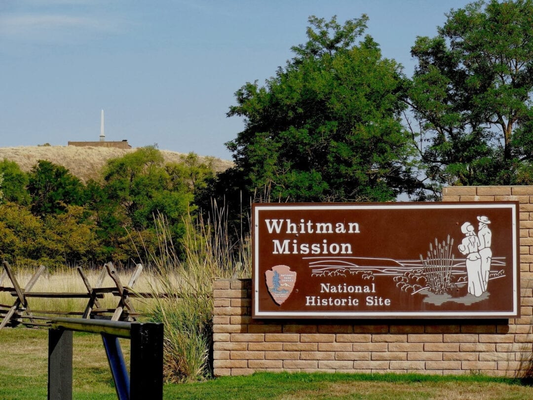 A National Historic Site sign marks the entrance of Whitman Mission.