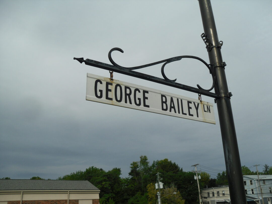 a black and white street sign for George Bailey LN
