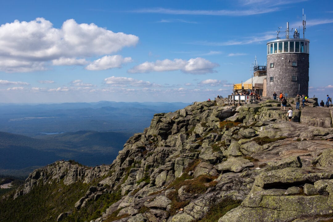 a mountain overlook with a weather station at the rocky summit
