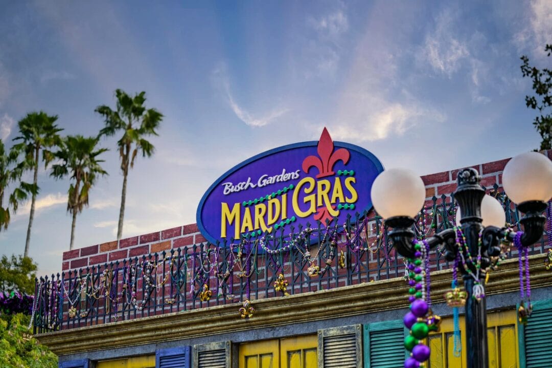 A sign that reads "Busch Gardens Mardi Gras" announces a seasonal event that takes place in Tampa, Florida.