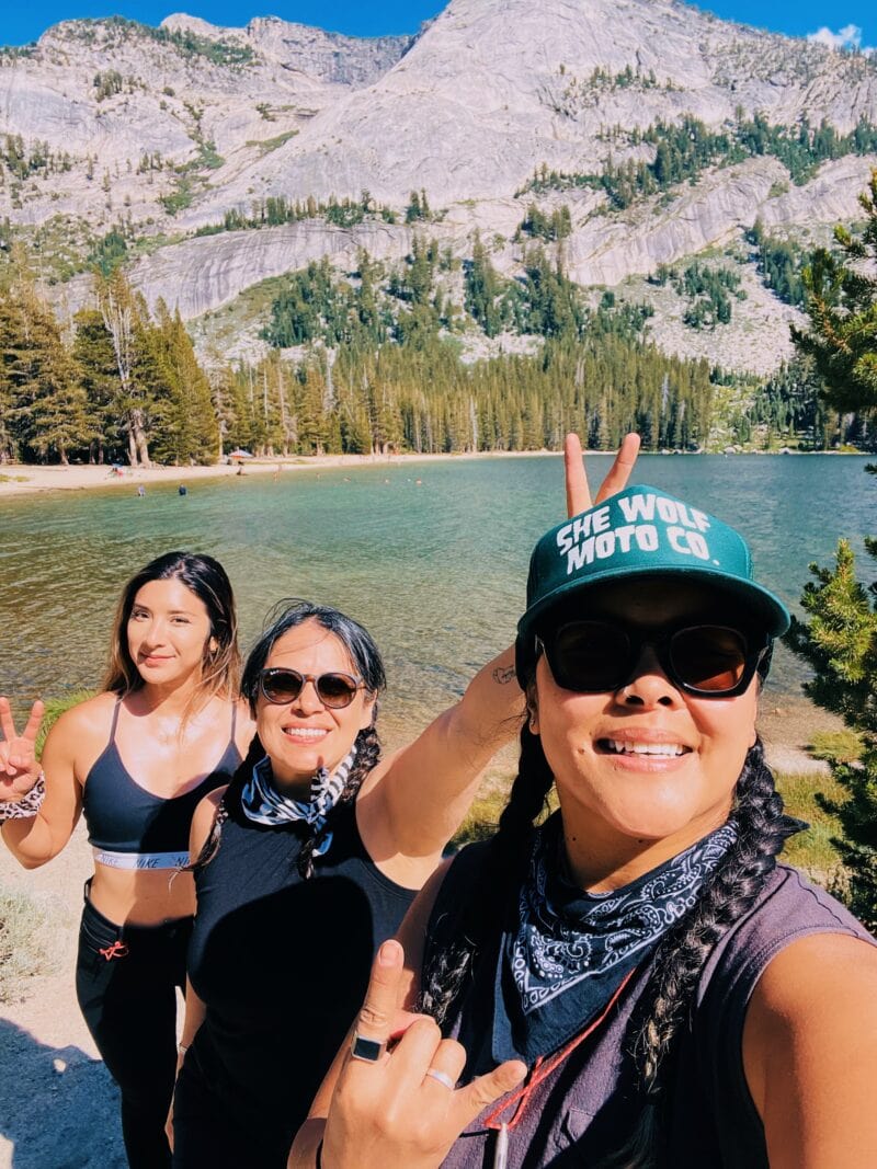 The author and two friends pose for a selfie in front of Yosemite's Tenaya Lake