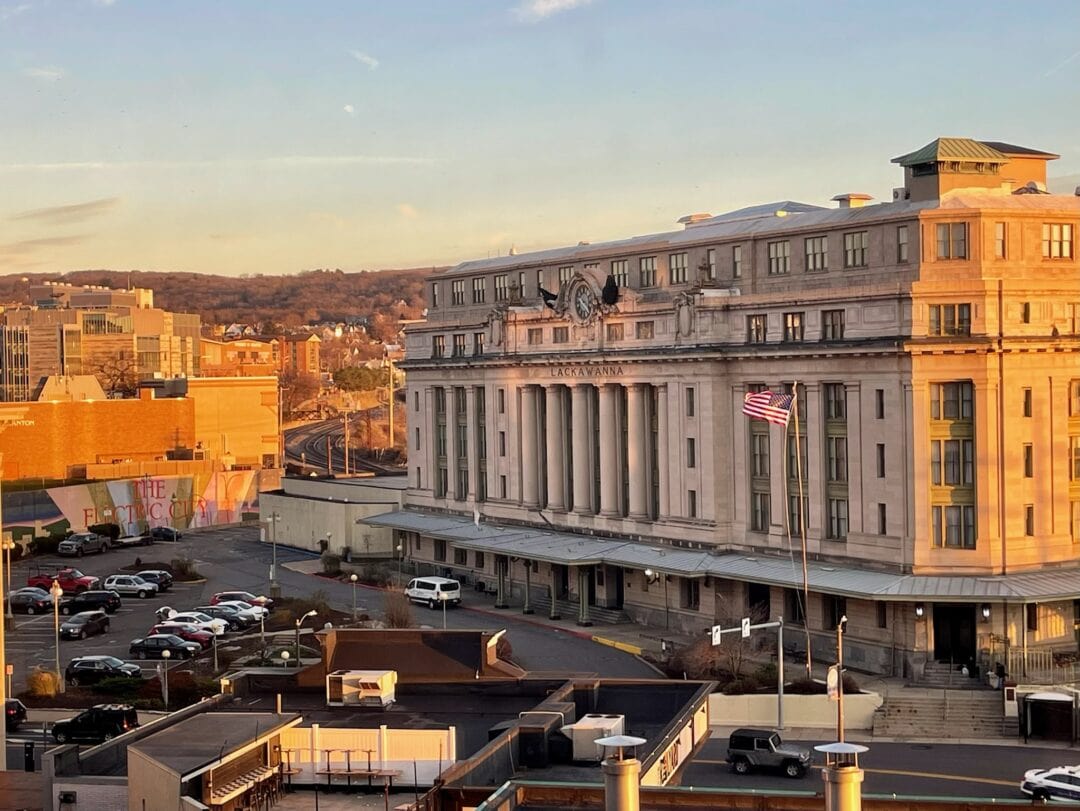 A large, historic looking building looms large over the town of Scranton, PA.