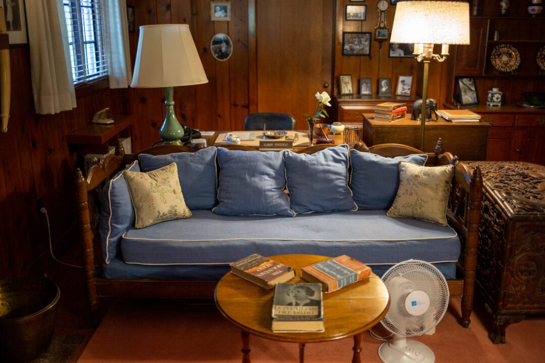The interior of Eleanor Roosevelt's office at Val-Kill features a well-worn blue couch and other cozy home finishes.