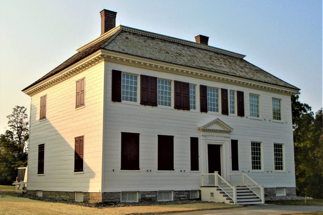 The Johnson Hall State Historic Site is a stately looking two-story white building.
