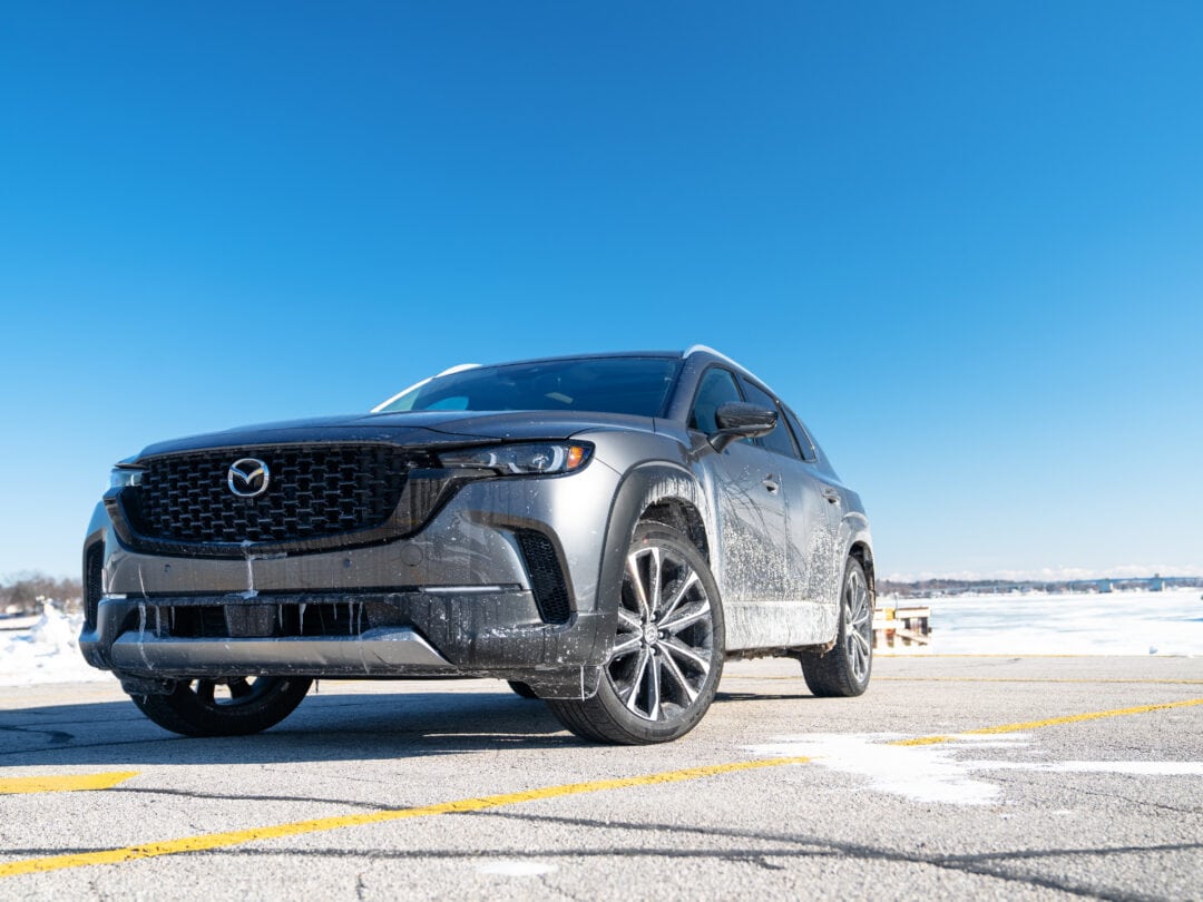 A ground-level view of the Mazda CX-50 shows that it's been through rugged, wintery terrain