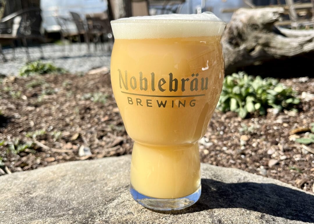 A pint of beer is etched with the words "Noblebräu Brewing"