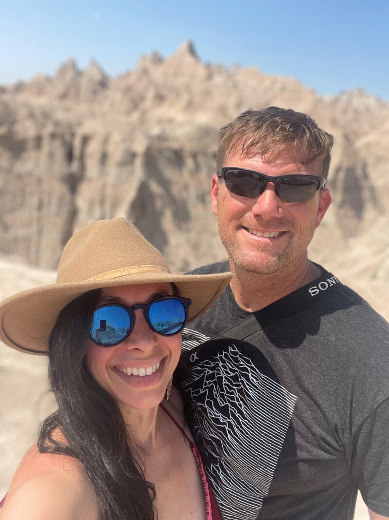 A couple poses for a photo at South Dakota's Badlands National Park