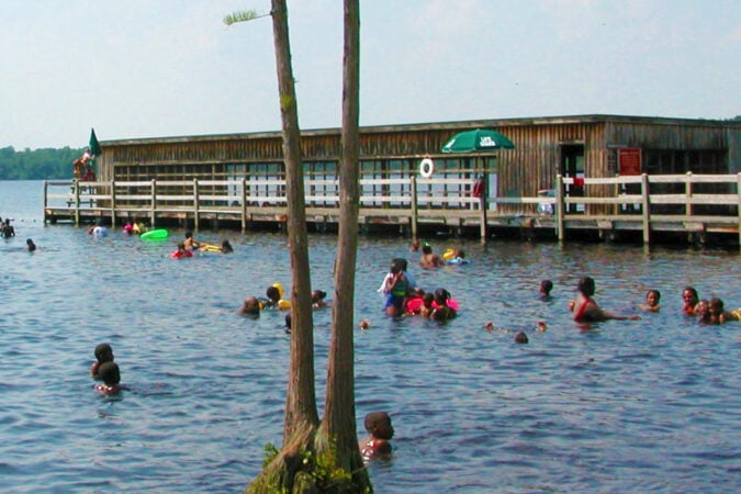 A full-color photo of the swimming area at Jones Lake State Park shows what the area looks like today