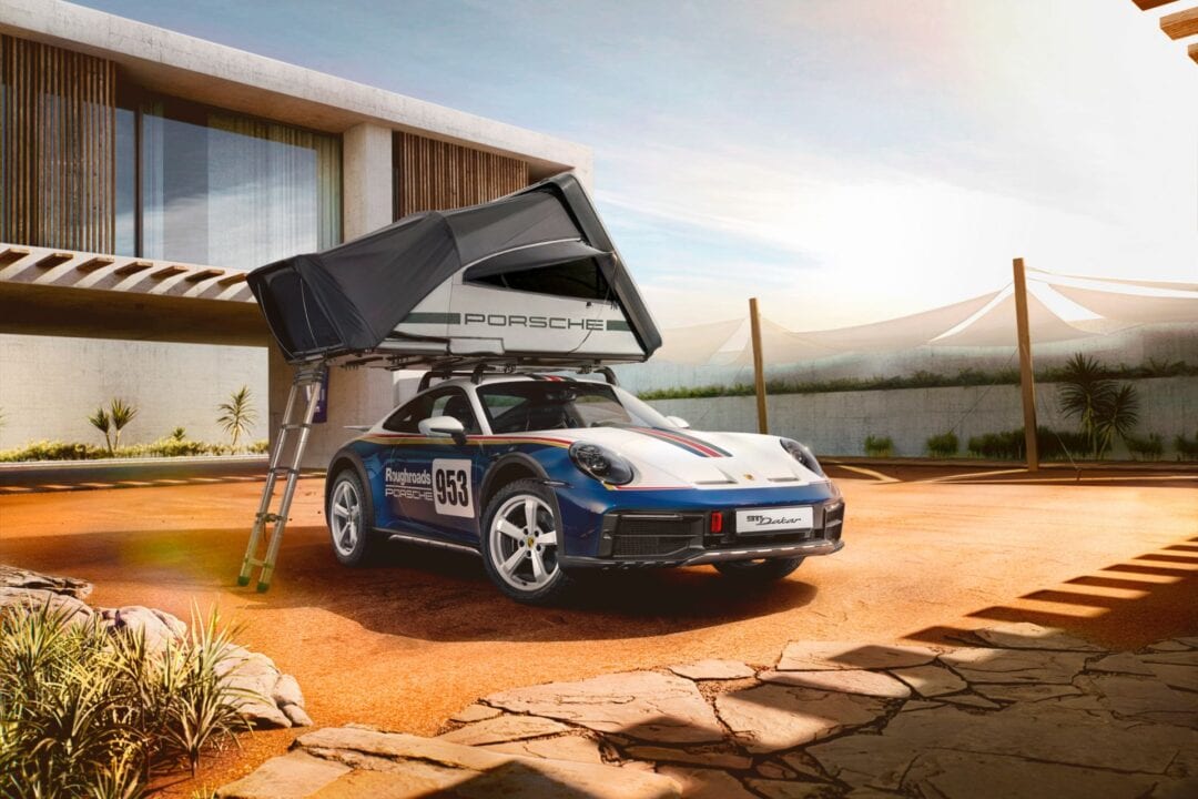 A tent sits atop a 2023 Porsche 911 Dakar