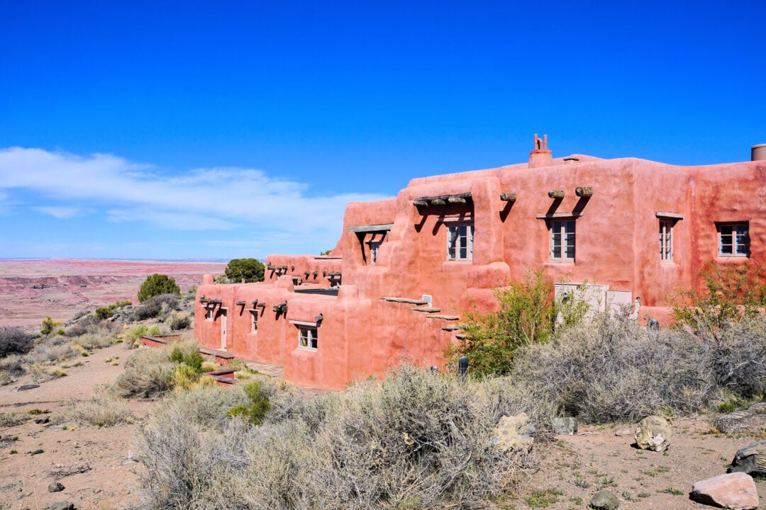 Adobe building overlooking a desert landscape