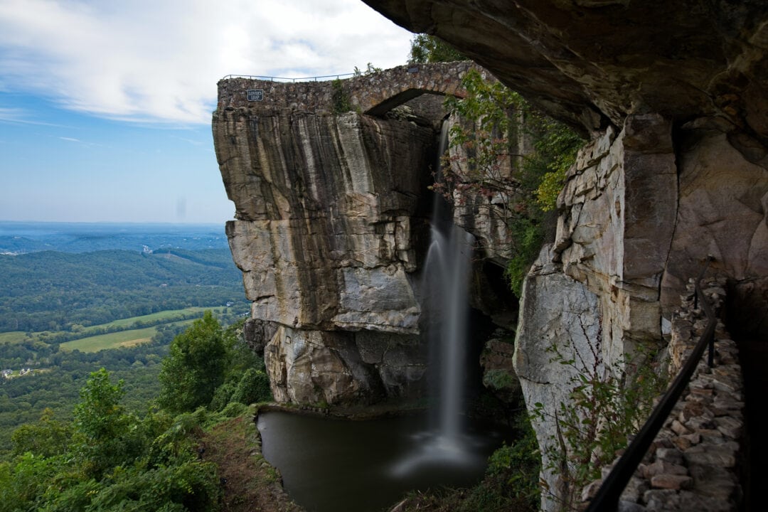 A waterfall cascades off a dramatic cliff at Rock City