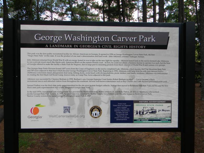 A sign featuring information on George Washington Carver State Park