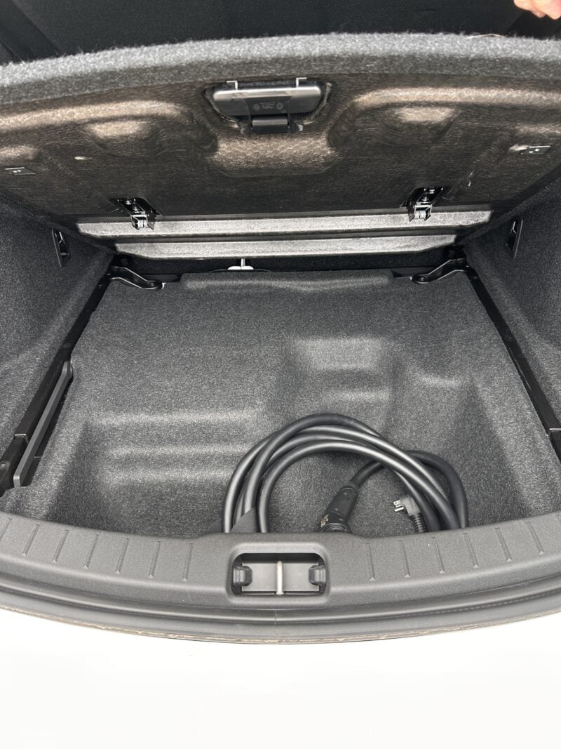 A charging cord stored in the trunk of the Polestar 2.