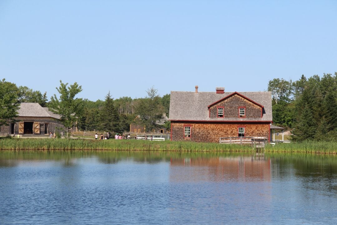 A 17th century brick house stands next to a lake