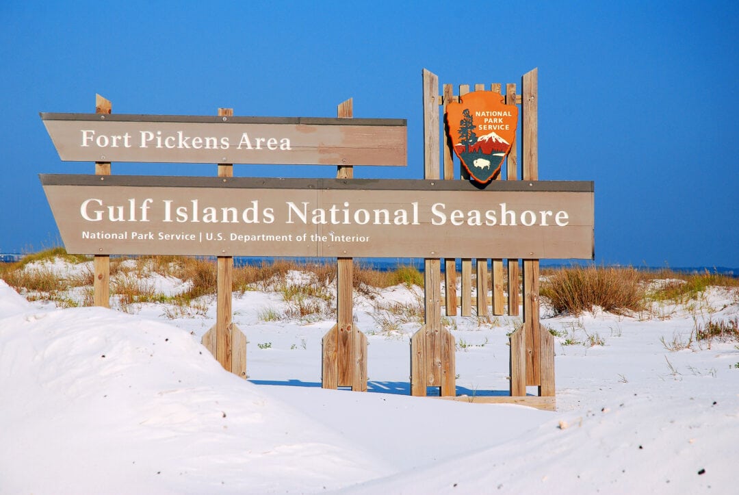 A sign welcomes visitors to the Gulf Islands National Seashore near Pensacola, Florida