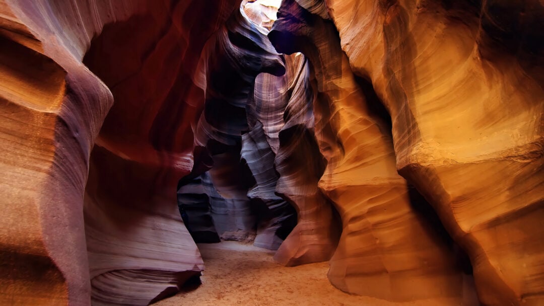 Light bounces off of unique slot canyon formations in Antelope Canyon
